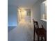 Hallway with carpet, doors, and a pass-through bar for entertaining guests at 291 Sea Cloud Cir # 291, Edisto Island, SC 29438