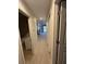 Hallway that features carpet, neutral walls, and doorways leading to different rooms at 291 Sea Cloud Cir # 291, Edisto Island, SC 29438