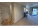 Stylish living space with a pass-through bar, carpeted floor, and bright entryway at 291 Sea Cloud Cir # 291, Edisto Island, SC 29438