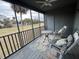 Inviting screened porch with comfortable chairs and scenic views of the yard at 291 Sea Cloud Cir # 291, Edisto Island, SC 29438