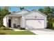 Charming single-story home with a two-car garage and inviting front porch at 301 Pine Crest View Dr, Summerville, SC 29486