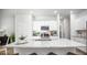 Bright kitchen featuring a large island with granite countertops and white cabinetry at 301 Pine Crest View Dr, Summerville, SC 29486
