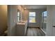 Modern bathroom with dual sinks, a glass-enclosed shower, and natural light, offering style and functionality at 321 Blue Haw Dr, Moncks Corner, SC 29461
