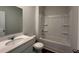 Well-lit bathroom featuring a combo tub and shower, plus a single sink vanity at 321 Blue Haw Dr, Moncks Corner, SC 29461