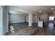 Open-concept living room and kitchen space with sleek floors at 321 Blue Haw Dr, Moncks Corner, SC 29461