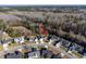 Home in residential neighborhood, nestled among trees, features a private pool and landscaped yard at 322 Equinox Cir, Ladson, SC 29456