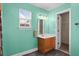 Bathroom features a vanity with wood cabinets, stylish mirror, and natural light from the window at 322 Equinox Cir, Ladson, SC 29456