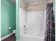 Bright bathroom with a shower and tub combination showcasing a sleek shower head and white tile at 322 Equinox Cir, Ladson, SC 29456