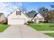 Charming single Gathering home with a well maintained lawn, driveway and a bright blue front door at 322 Equinox Cir, Ladson, SC 29456