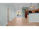 Open kitchen with granite countertops, wood cabinets, stainless steel appliances, and access to the backyard at 322 Equinox Cir, Ladson, SC 29456