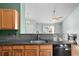 Close up of kitchen with stainless appliances, wood cabinets, and granite counter tops at 322 Equinox Cir, Ladson, SC 29456