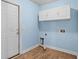 Functional laundry room with upper cabinets, tile floor, and convenient hookups at 322 Equinox Cir, Ladson, SC 29456