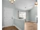 Inviting living room featuring wood floors, fireplace, and large windows for natural light at 322 Equinox Cir, Ladson, SC 29456