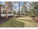 Spacious backyard featuring mature landscaping and an enclosed porch at 3334 Merion Pl, Mount Pleasant, SC 29466