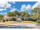 Beautiful community clubhouse with palm trees and landscaping under a sunny sky at 3334 Merion Pl, Mount Pleasant, SC 29466