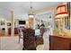 Formal dining room features a glass table, ornate chairs, and open floorplan at 3334 Merion Pl, Mount Pleasant, SC 29466