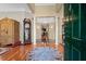Elegant foyer with hardwood floors, columns, chandelier, and view of formal areas at 3334 Merion Pl, Mount Pleasant, SC 29466