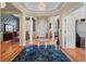 Elegant foyer boasts marble flooring, decorative pillars, and a chandelier, creating a grand entrance at 3334 Merion Pl, Mount Pleasant, SC 29466