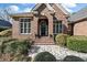 Elegant front entrance with brick steps, a beautifully designed door, and lush landscaping at 3334 Merion Pl, Mount Pleasant, SC 29466