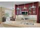 Kitchen featuring granite countertops, stainless steel appliances, and glass display cabinets at 3334 Merion Pl, Mount Pleasant, SC 29466