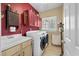 Functional laundry room with modern washer and dryer, storage cabinets, a sink, and a window for natural light at 3334 Merion Pl, Mount Pleasant, SC 29466