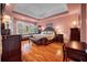 Spacious main bedroom with hardwood floors, sitting area, and stylish decor at 3334 Merion Pl, Mount Pleasant, SC 29466