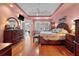 Large main bedroom with hardwood flooring, a seating area, and direct access to an adjoining room at 3334 Merion Pl, Mount Pleasant, SC 29466