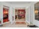 Sunroom featuring double French doors, tile flooring, and views into other rooms of the home at 3334 Merion Pl, Mount Pleasant, SC 29466