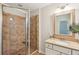 Bathroom featuring sink, granite countertop, and tiled shower with glass door at 3920 Hanoverian Dr, Mount Pleasant, SC 29429