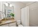 Bathroom features a shower/tub combo, granite sink and a decorative mirror at 3920 Hanoverian Dr, Mount Pleasant, SC 29429