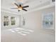 Spacious bedroom featuring a ceiling fan, neutral carpet, and windows providing ample natural light at 3920 Hanoverian Dr, Mount Pleasant, SC 29429