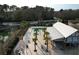 Community pool and recreation area surrounded by lush greenery, offering a serene and inviting ambiance at 3920 Hanoverian Dr, Mount Pleasant, SC 29429