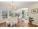 Light filled dining room features hardwood floors, decorative lighting and a large window at 3920 Hanoverian Dr, Mount Pleasant, SC 29429