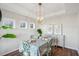 Charming dining room with stylish light fixture, seating for four, and elegant decor at 3920 Hanoverian Dr, Mount Pleasant, SC 29429