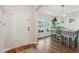 Inviting entryway featuring a white front door, hardwood floors, and a charming dining area at 3920 Hanoverian Dr, Mount Pleasant, SC 29429
