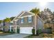 Two-story home featuring stone accents, an attached two-car garage, and a manicured front yard at 3920 Hanoverian Dr, Mount Pleasant, SC 29429