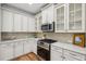 Charming kitchen features stainless steel appliances, white cabinets and granite countertops at 3920 Hanoverian Dr, Mount Pleasant, SC 29429