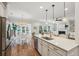 Beautiful island kitchen view shows the sink, island with bar seating, dining and living areas at 3920 Hanoverian Dr, Mount Pleasant, SC 29429