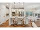 Eat-in kitchen with stainless appliances, island seating, and elegant light fixtures at 3920 Hanoverian Dr, Mount Pleasant, SC 29429