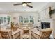 Bright and airy living room with neutral furniture, fireplace, and large windows at 3920 Hanoverian Dr, Mount Pleasant, SC 29429