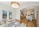 A view through the sun room to the dining room and kitchen beyond at 3920 Hanoverian Dr, Mount Pleasant, SC 29429