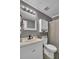 Bathroom featuring a modern vanity, framed mirror, and shower with gray tiling at 4516 Logwood Dr, Ladson, SC 29456