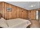 Cozy bedroom with rustic wood paneling and comfortable carpet flooring at 4516 Logwood Dr, Ladson, SC 29456