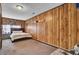 Cozy bedroom with rustic wood paneling and comfortable carpet flooring at 4516 Logwood Dr, Ladson, SC 29456