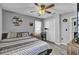 A well lit bedroom with a double bed, neutral walls, hardwood floors, and a cat tree at 4516 Logwood Dr, Ladson, SC 29456