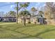 Inviting home exterior showcasing a lush lawn and a mature palm tree at 4516 Logwood Dr, Ladson, SC 29456