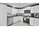 Well-lit kitchen featuring modern appliances and stylish countertops at 4516 Logwood Dr, Ladson, SC 29456