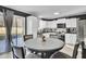 Bright kitchen features white cabinetry, stainless steel appliances, and sliding glass door to yard at 4516 Logwood Dr, Ladson, SC 29456