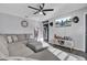 Bright living room featuring a modern sectional sofa and a wall-mounted television at 4516 Logwood Dr, Ladson, SC 29456