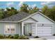 Charming single-story home with light green siding, a two car garage, and well manicured landscaping at 564 Richfield Way, Summerville, SC 29486